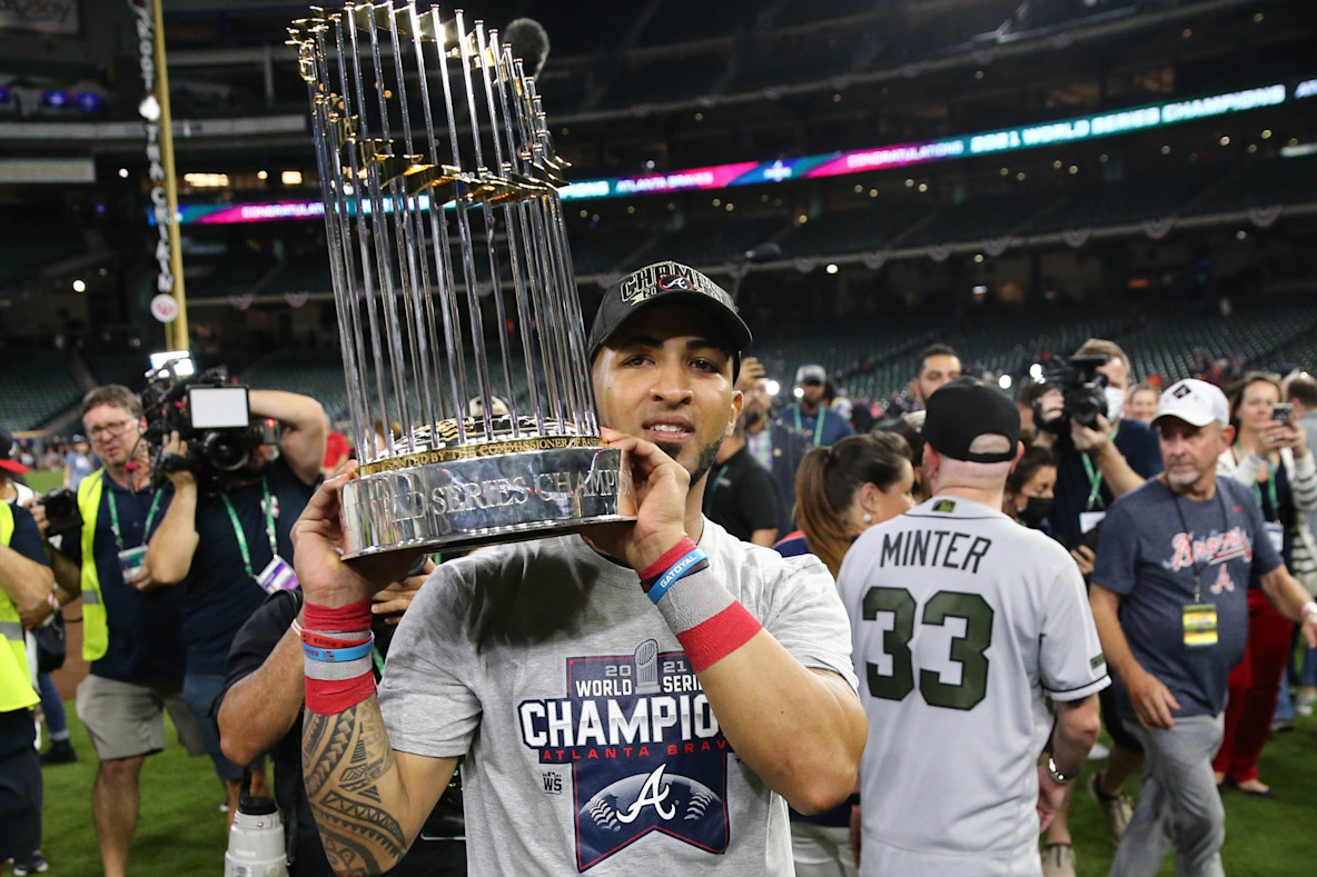 Baseball_MLB_Atlanta Braves' Eddie Rosario with the Commissioner's Trophy