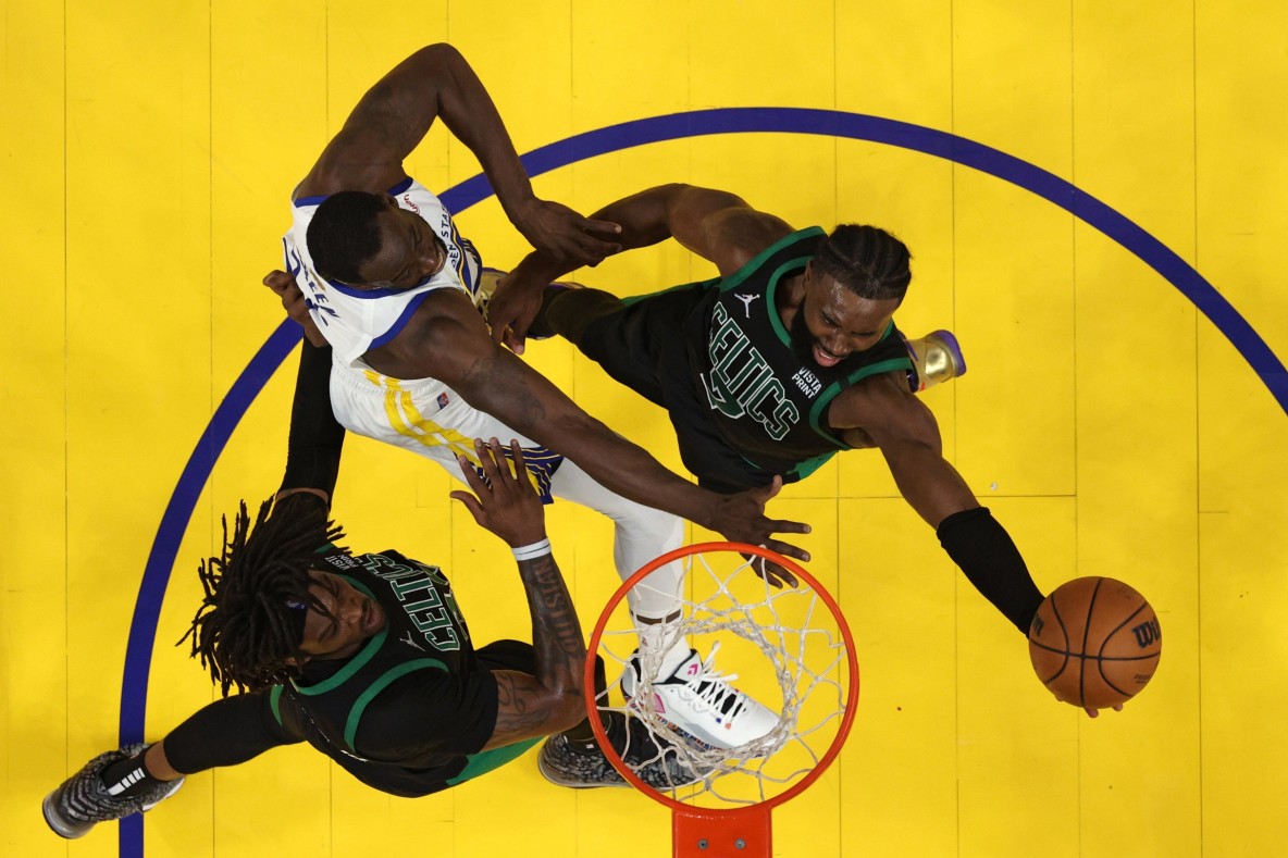 Basketball_NBA_Boston Celtics' Jaylen Brown and Golden State Warriors' Draymond Green