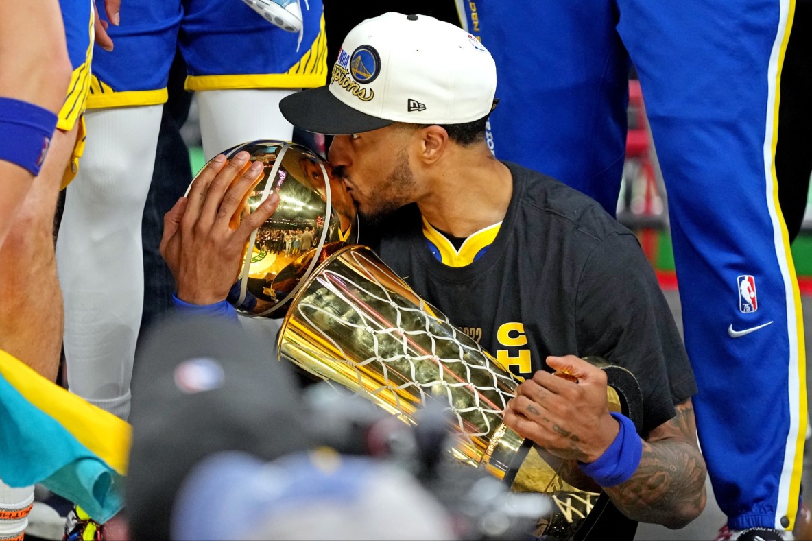 Basketball_NBA_Golden State Warriors' Gary Payton II with the Larry O'Brien Championship Trophy