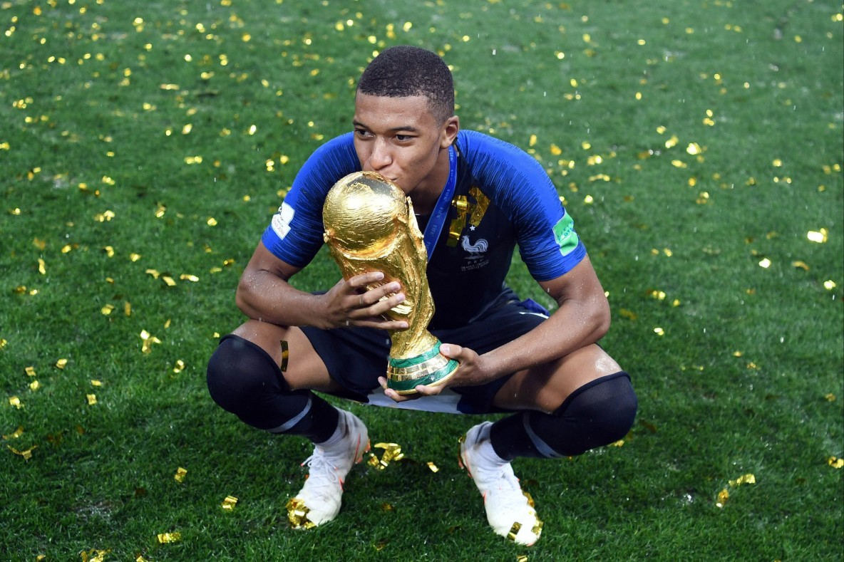 Soccer_World Cup_France forward Kylian Mbappe with the World Cup trophy
